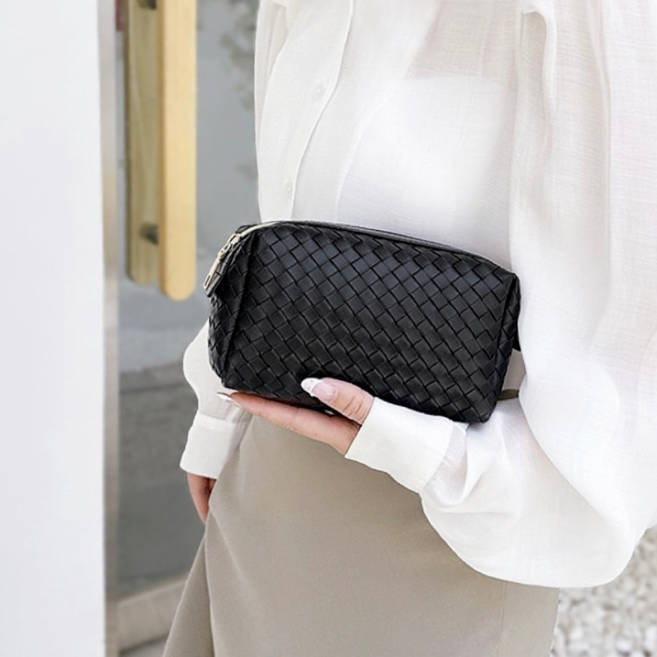 Borsa per il trucco in pelle intrecciata