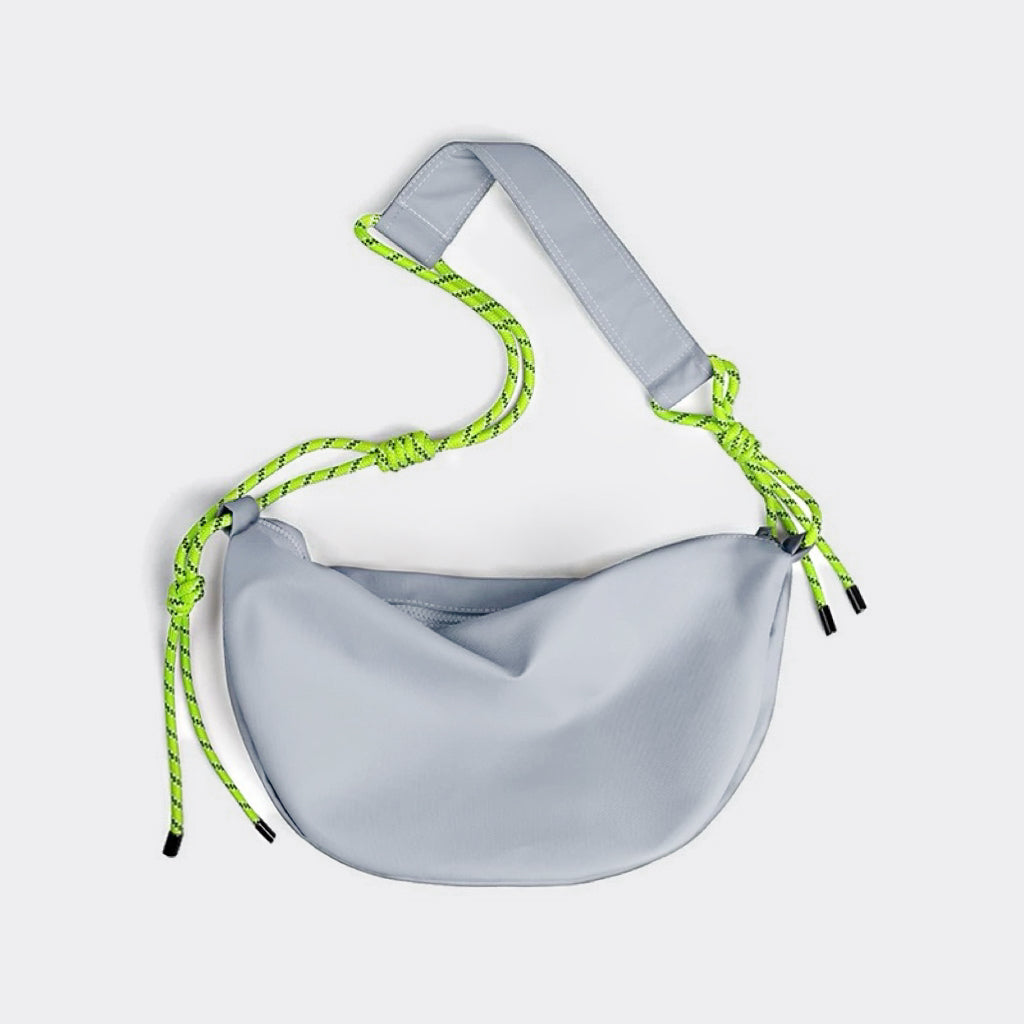 Front view of light grey nylon crescent bag with neon knotted strap detail, unique streetwear hobo bag.