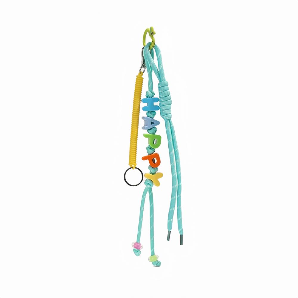 Flat lay of Letters Bag Charm with LUCKY letters and blue ropes , great for everyday styling and gifting.