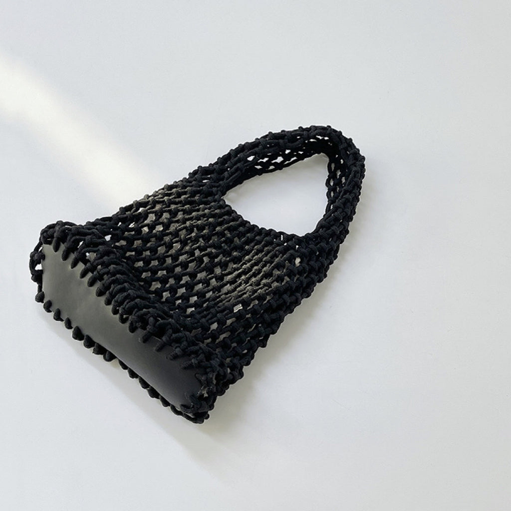 Close-up of Small Multi-Colored Crochet Handbag in black, easy for commuting and weekends.