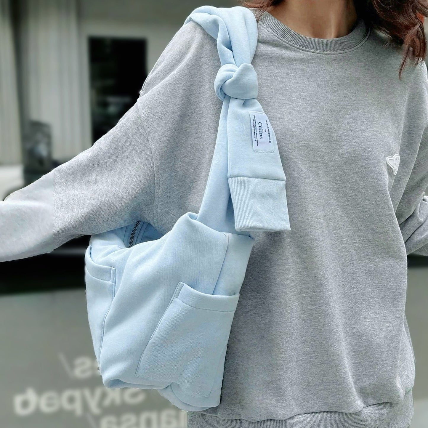 Borsa con manicotto Twist &amp; Tie