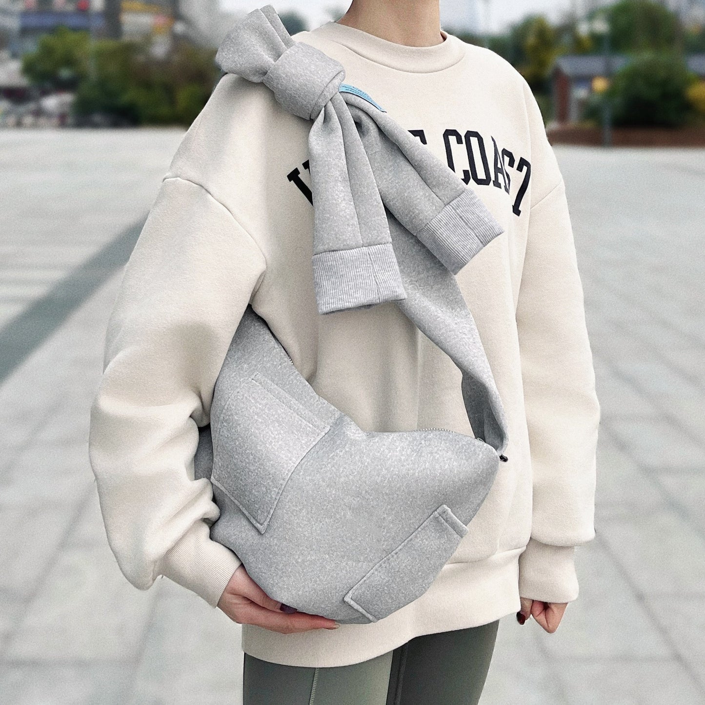 Borsa con manicotto Twist &amp; Tie