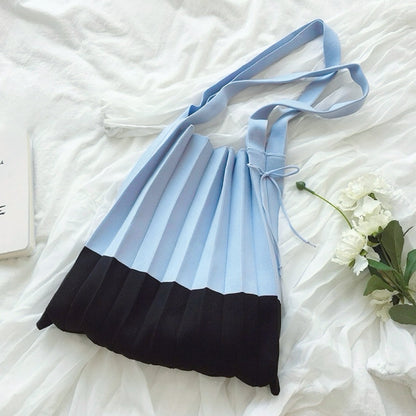 Folded view of Accordion Foldable Knitted Bag in pale blue and black, ideal for errands and gifting.