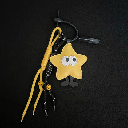 Close-up of Big-eyed Stars Bag Charm in yellow , ideal for travel and daily use.