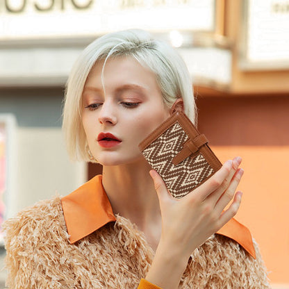 Model holding Bohemia Small Wallet, great for daily carry and travel.