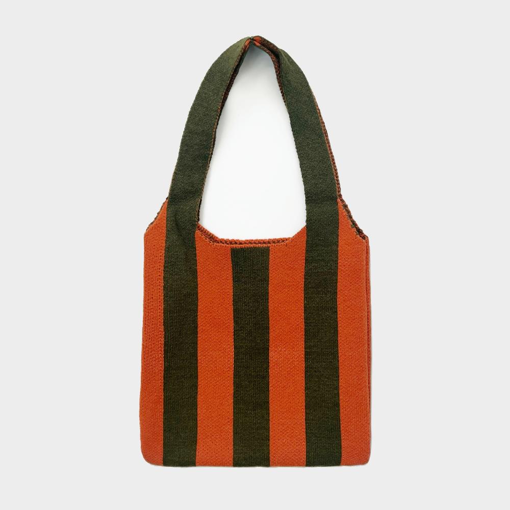 Folded view of Bold Band Knit Bag in orange, easy for commuting and weekends.