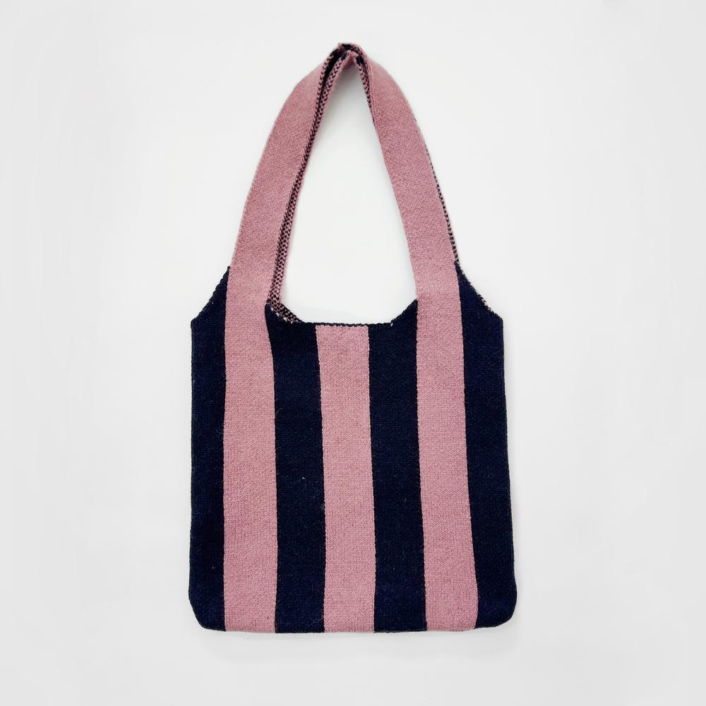 Front view of Pink and navy striped wool blend knit shoulder bag,  great for everyday carry and travel.