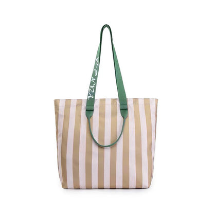 Flat lay of Bold Color Striped Tote Bag in khaki, great for everyday carry and travel.