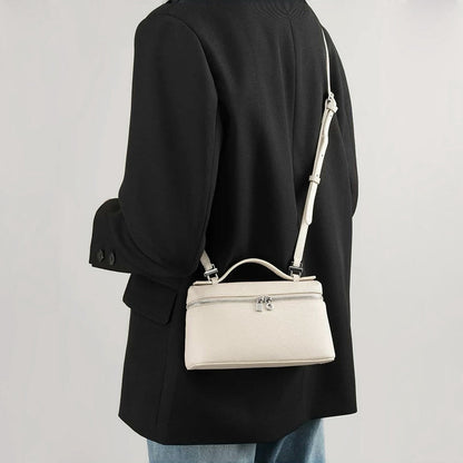 Model carrying a white bag as crossbody, easy for commuting and weekends.