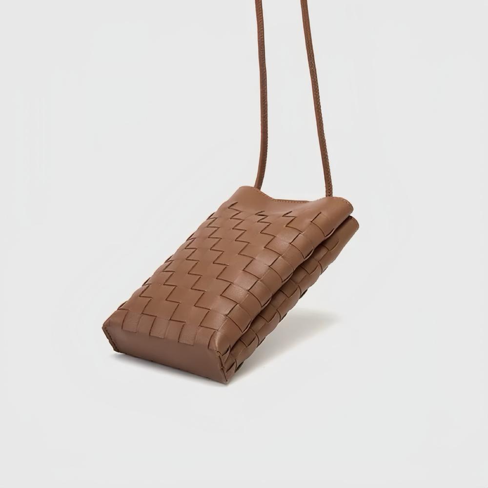 Folded view of Braid Elegance Crossbody Bag, easy for commuting and weekends.