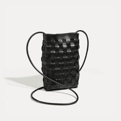 Flat lay of Braid Elegance Crossbody Bag in black, ideal for errands and gifting.