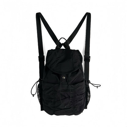 Classic black pleated nylon backpack; minimalist and sleek aesthetic for professional work or school.