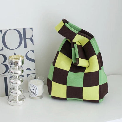 Close-up of  Green and brown checkered tote bag, ideal for errands.