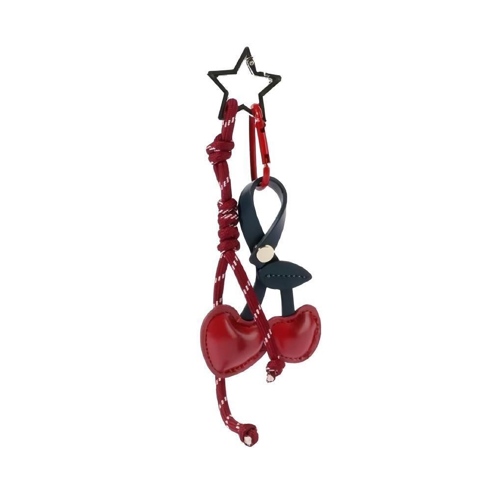 Front view of Red PU leather cherry bag charm with a star keyring and dark blue strap, great for everyday styling.