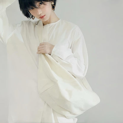 Model carrying a Chic Day Hobo Bag in white, ideal for errands and gifting.