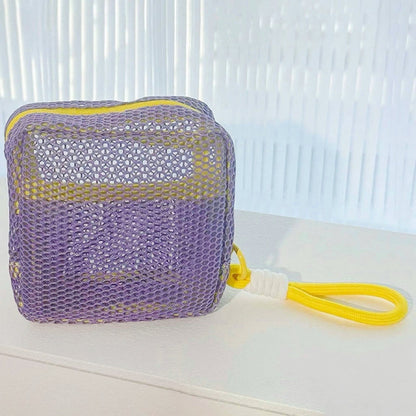 Lilac Chroma mesh pouch with yellow wrist lanyard; mesh zip pouch for cosmetics, cords, and daily carry.