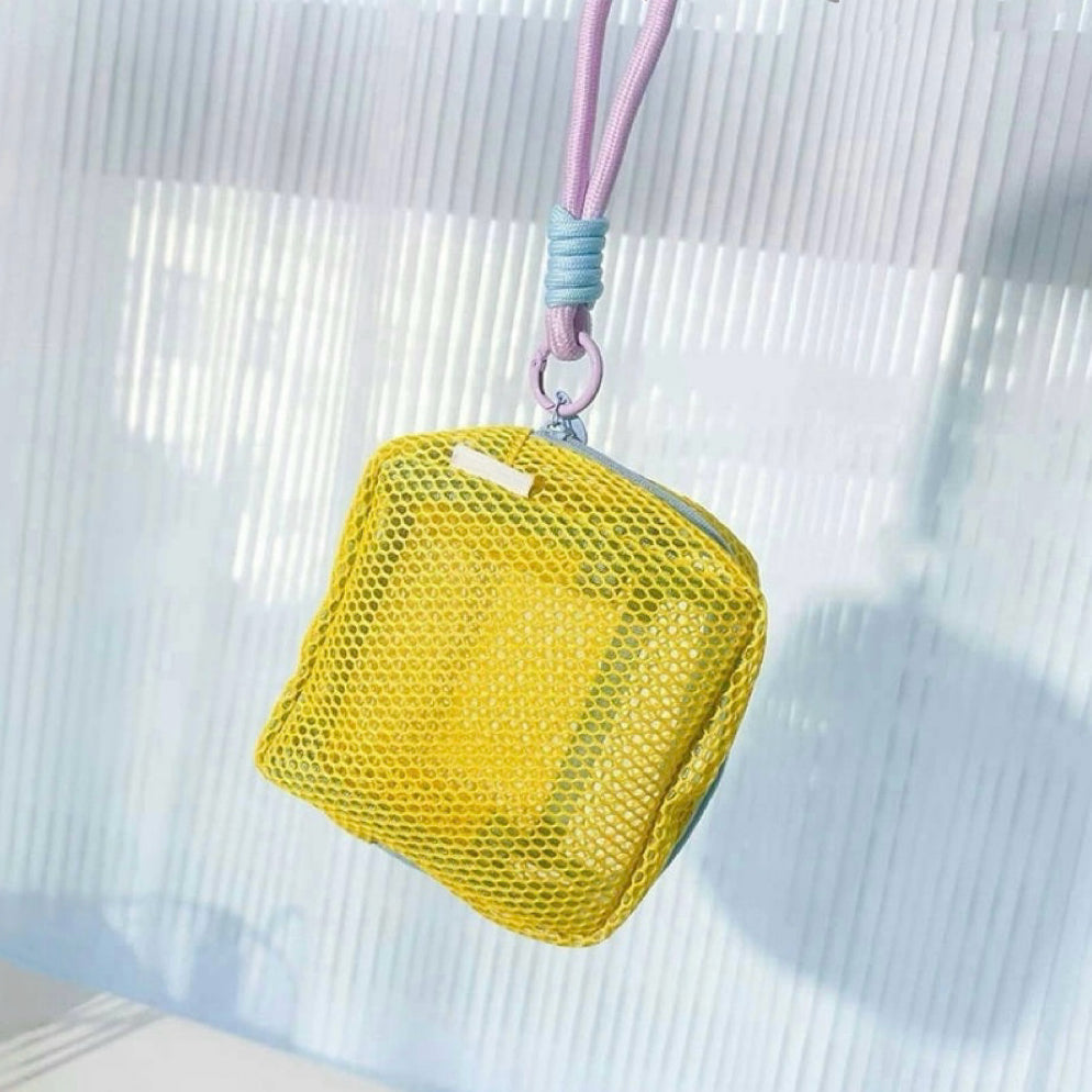 Yellow Chroma mesh pouch with lanyard strap, hanging shot; lightweight zip organizer for keys or mini toiletries.