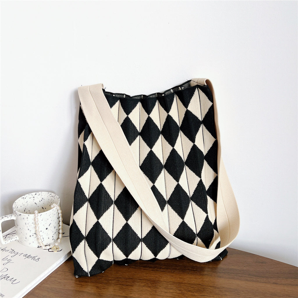 Minimalist black and beige argyle knitted tote bag featuring an open-top design.