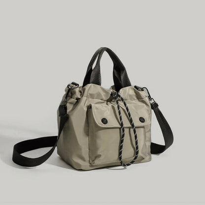 Khaki cube utility bag featuring a compact and durable design.