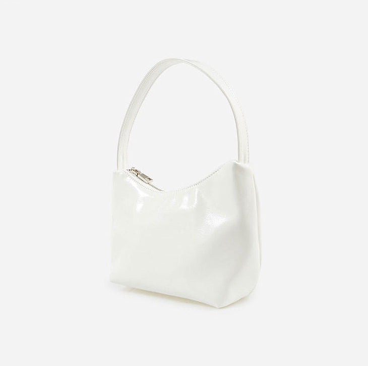Angled view of Cool Patent Leather Shoulder Bag in white, great for everyday carry and travel.