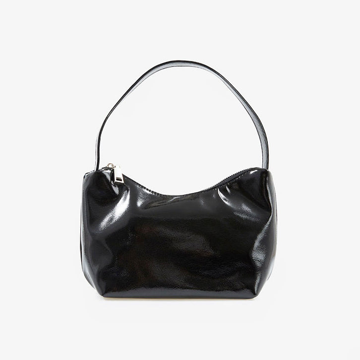 Flat lay of Cool Patent Leather Shoulder Bag in black, great for everyday carry and travel.
