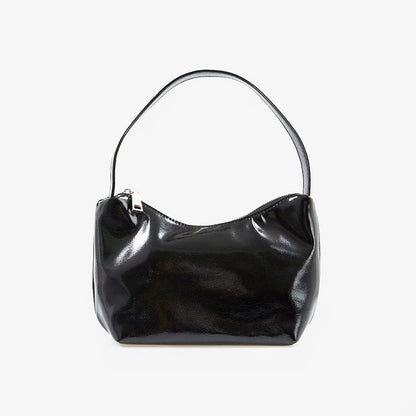 Flat lay of Cool Patent Leather Shoulder Bag in black, great for everyday carry and travel.