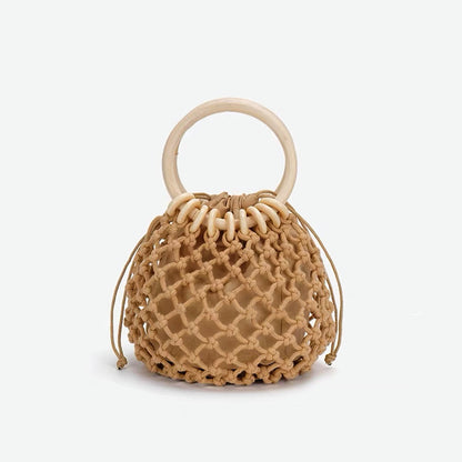 Close-up of brown crochet mini handbag with a light wooden ring .