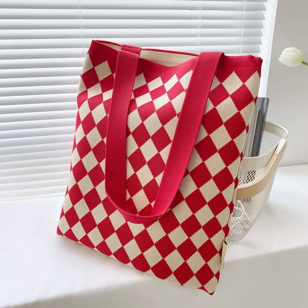 Flat lay of Diamond Knitted Tote Bag in red, great for everyday carry and travel.