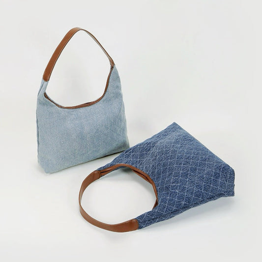 Two Diamond pattern Denim Shoulder Bags shown together, one dark blue and one light blue. 