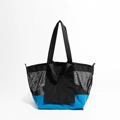 Front shot of the black and blue double-sided tote bag for a minimalist look.