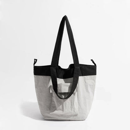 Folded view of Duotone Foldable Tote Bag in gray, easy for commuting and weekends.
