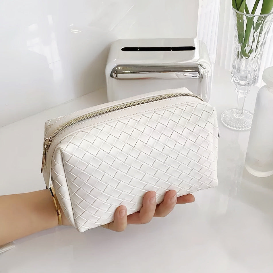 Borsa per il trucco in pelle intrecciata 