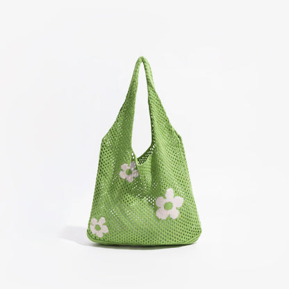 Flat lay of Flowers Crochet Shoulder Bag in green, great for everyday carry and travel.