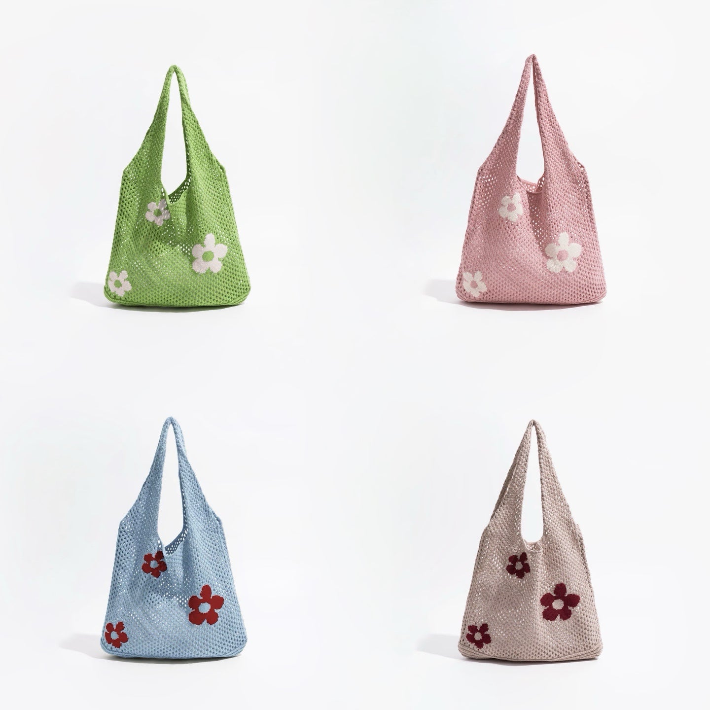 Front view of Four crochet shoulder bags in green, pink, blue, and khaki, each with white or red flower appliques.