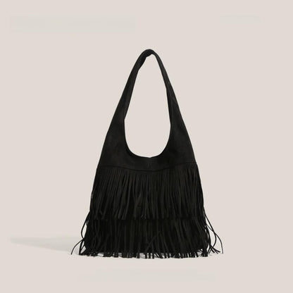 Classic black fringe suede hobo bag with a soft-touch finish and artisanal look.