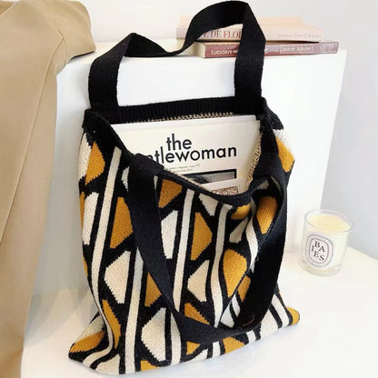 Flat lay of Geometric Contrast Color Knitted Tote Bag in black and yellow, great for everyday carry and travel.