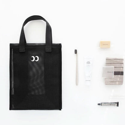 Folded view of Googly Eyes Mesh Shopper Bag in black, easy for commuting and weekends.