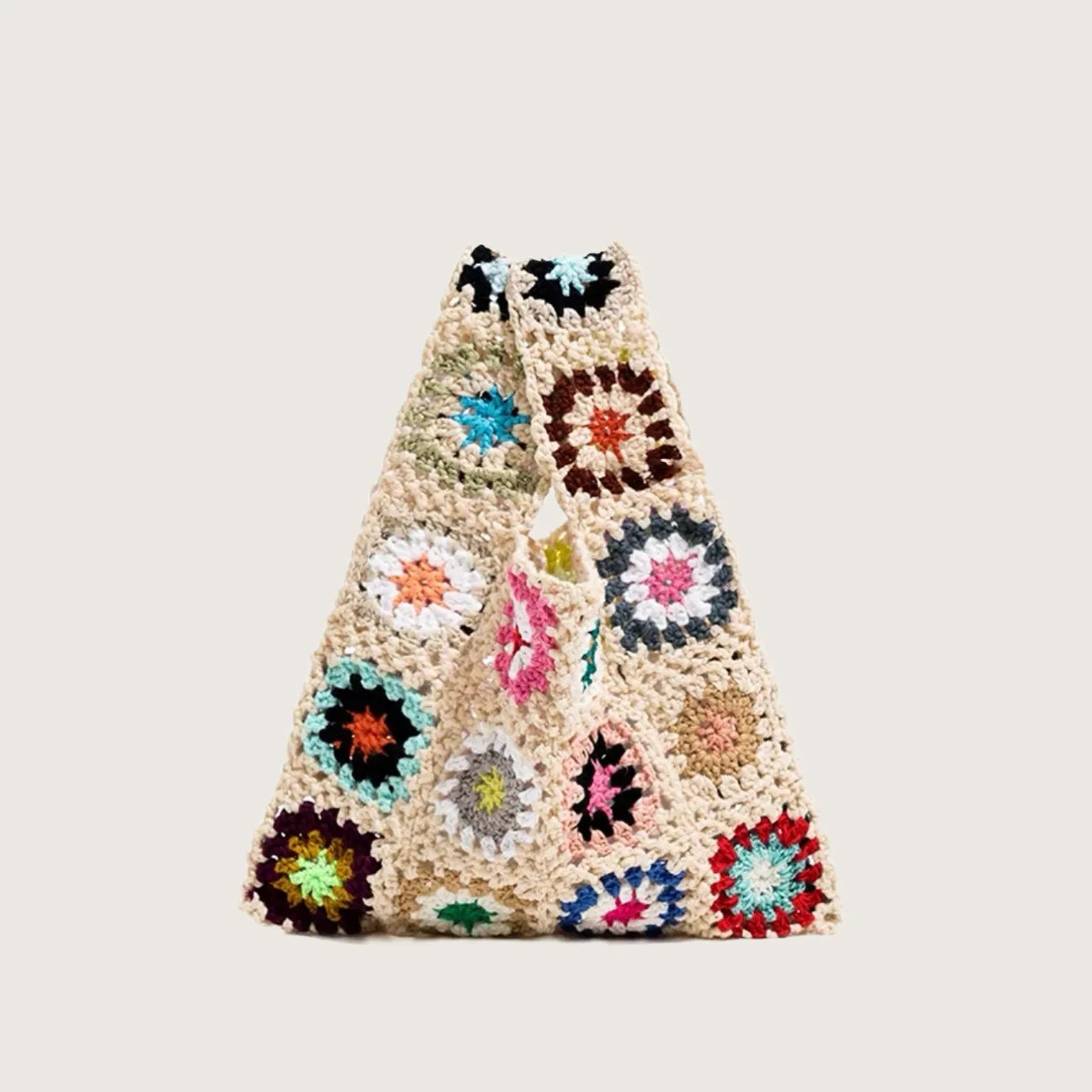 Flat lay of Handmade Crochet Flower Grid Bag in apricot, ideal for errands and gifting.