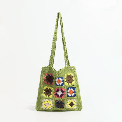 Flat lay of Handmade Crochet Flower Grid Shoulder Bag in green, great for everyday carry and travel.