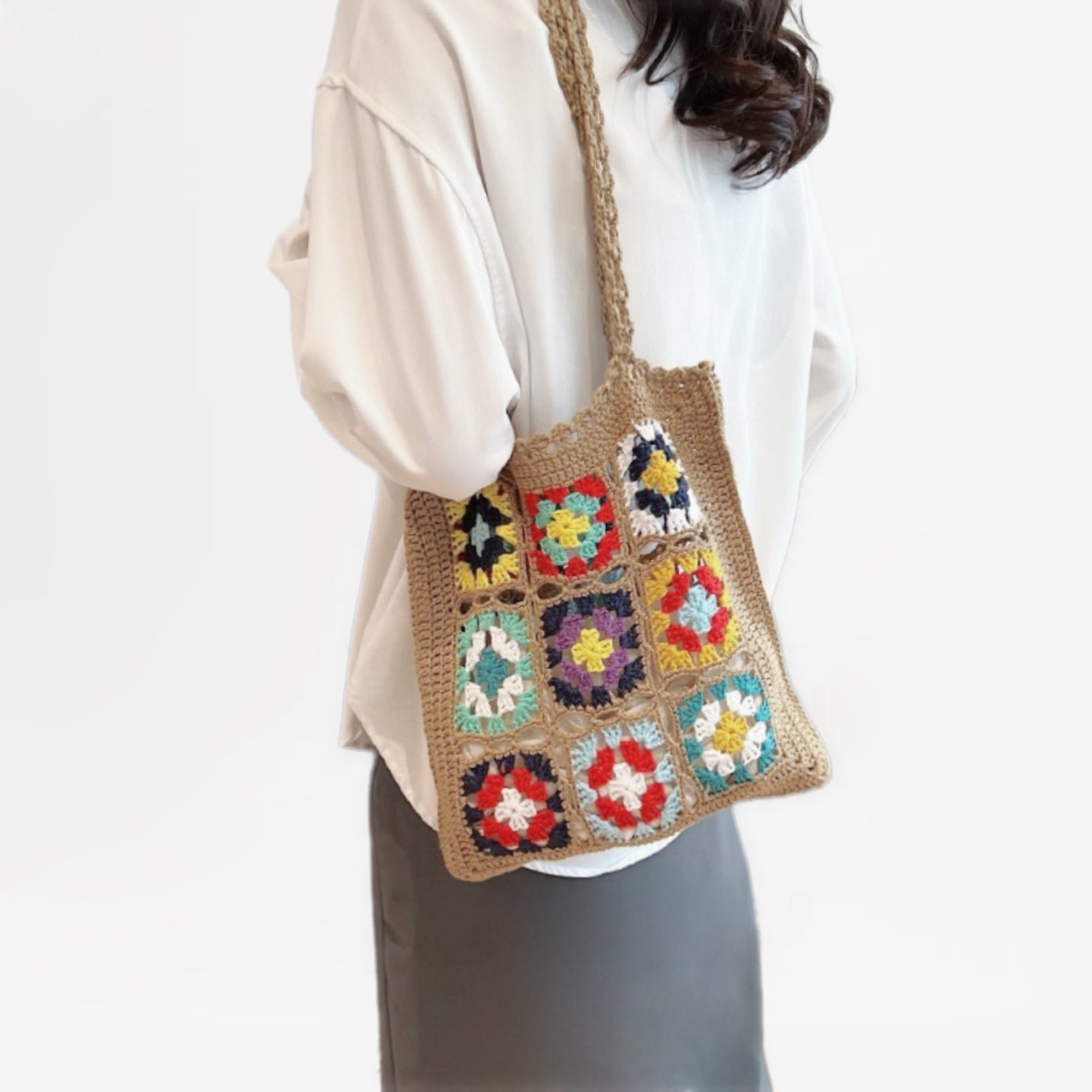 Model carrying a khaki Crochet Flower Grid Shoulder Bag, easy for commuting and weekends.