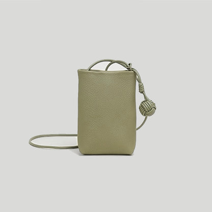 Flat lay of Hanging Ball Leather Bag in khaki green, great for everyday carry and travel.