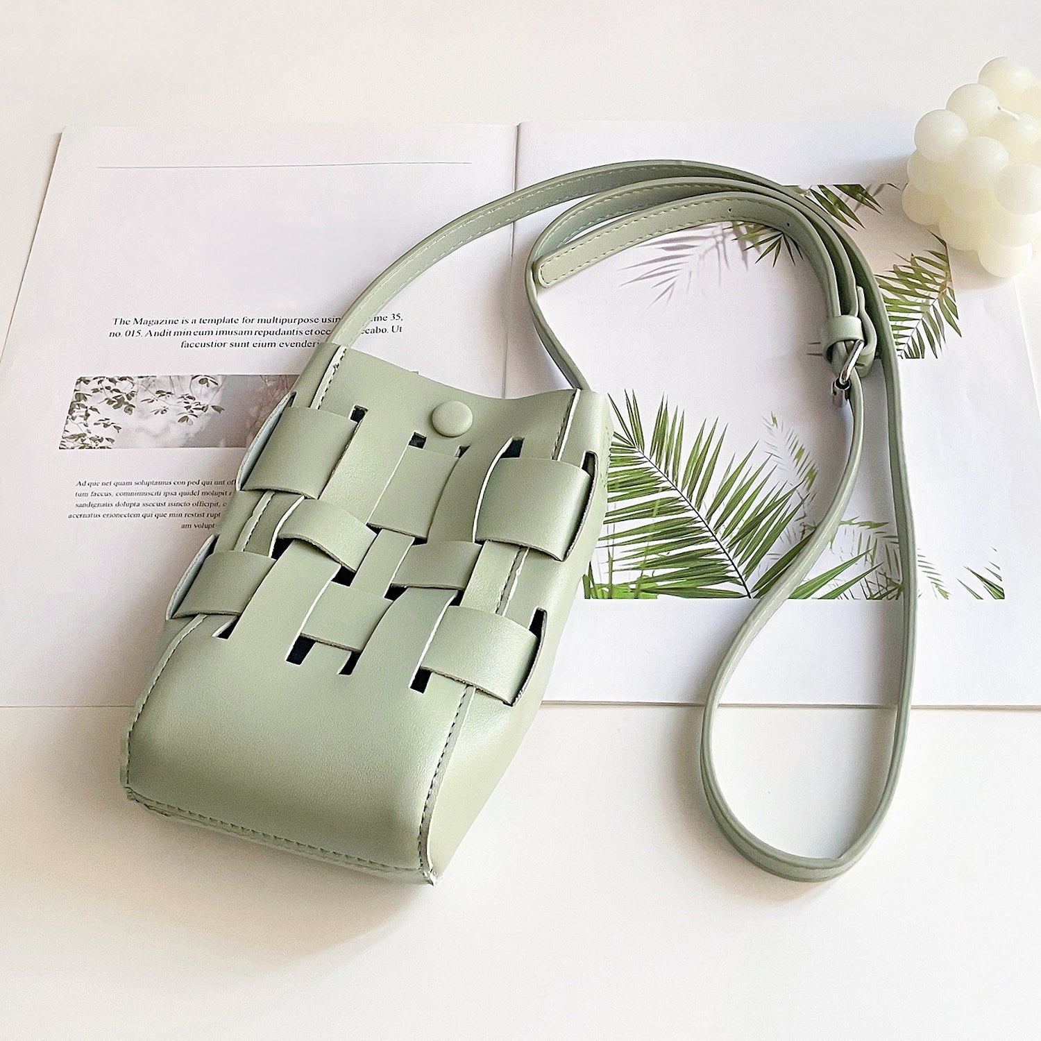 Angled view of Hollow Design Woven Leather Crossbody Bag in green, great for everyday carry and travel.