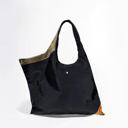 Front view of the Jungle tote bag showcasing the spacious compartment and contrast olive green lining.