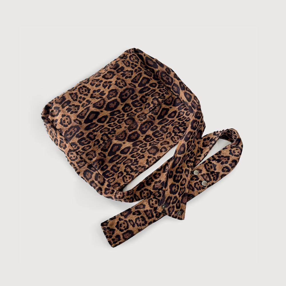 The leopard print tote bag shown folded to highlight the soft fabric texture.