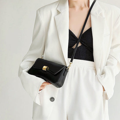 Model carrying a Light Leather Arc Baguette Shoulder Bag as crossbody , easy for commuting and weekends.