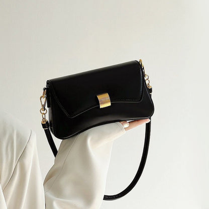 Model holding Light Leather Arc Baguette Shoulder Bag in hand, ideal for city walks and gifting.