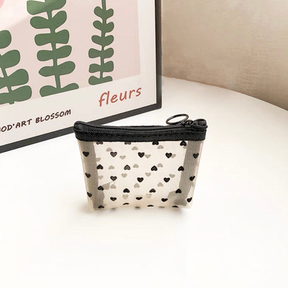 Close-up of a mini heart print organza bag; highlighting the flocked heart details and durable material.