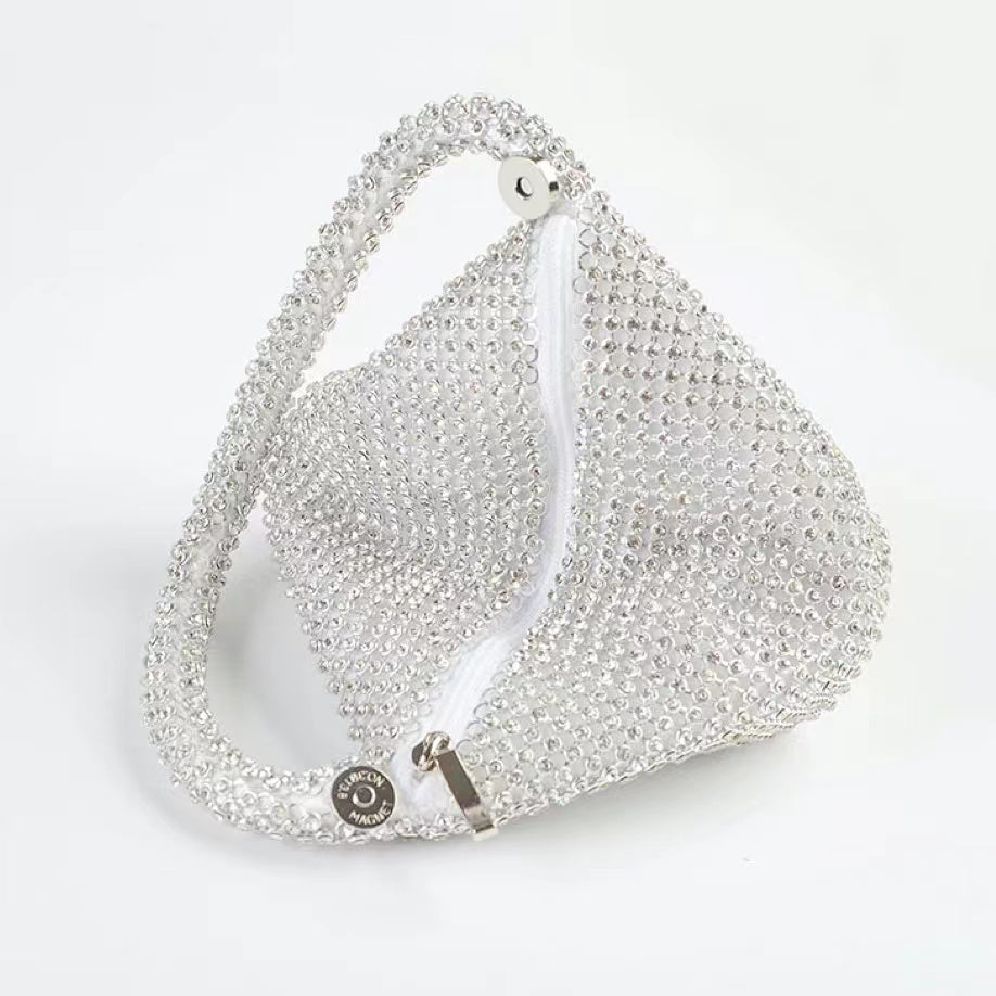 Top view of Mini Diamond Party Handbag in silver, showcasing the detail of the zipper.