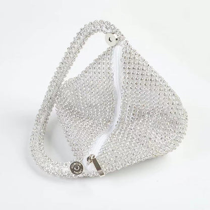 Top view of Mini Diamond Party Handbag in silver, showcasing the detail of the zipper.