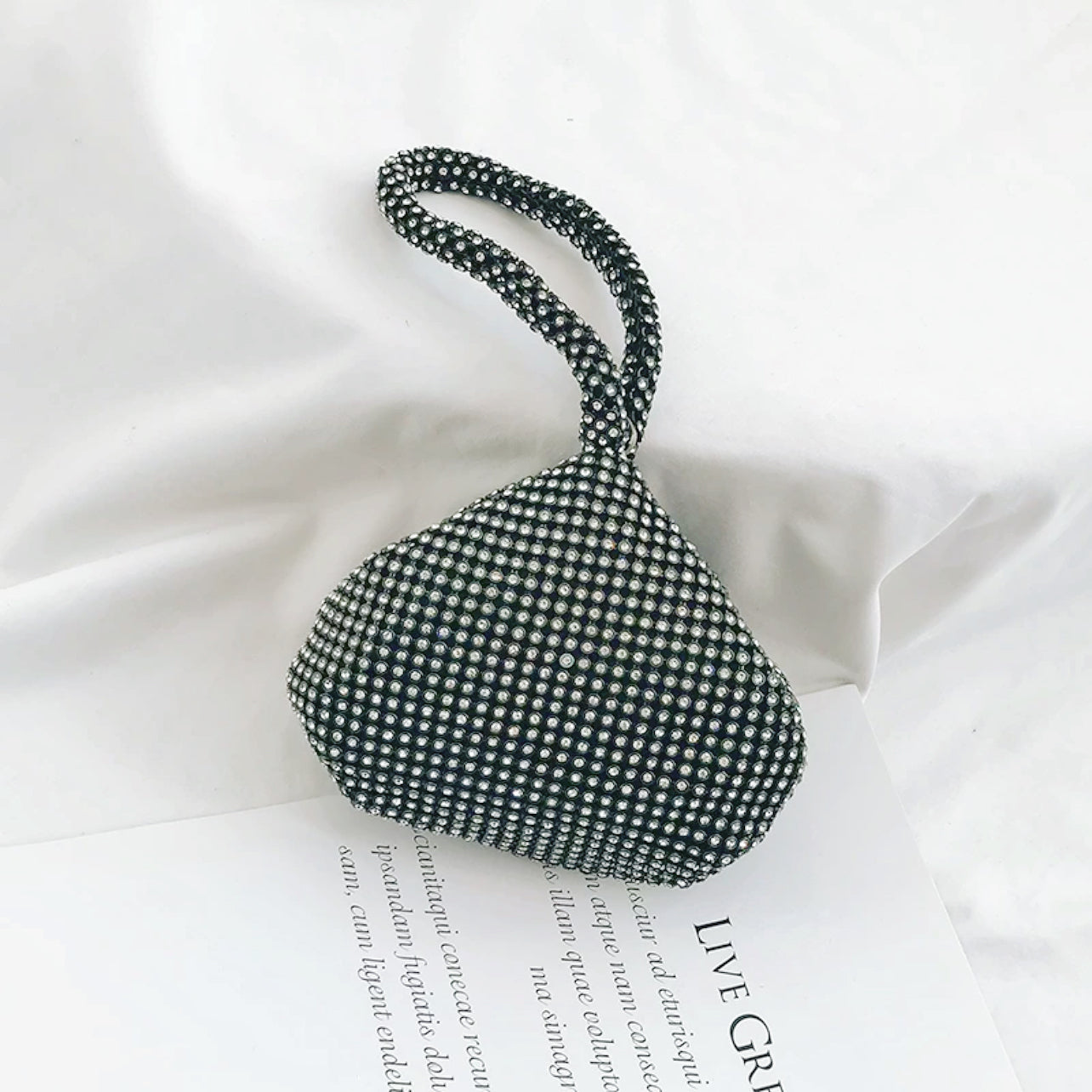 Flat lay of Mini Diamond Party Handbag in black, great for everyday carry and travel.